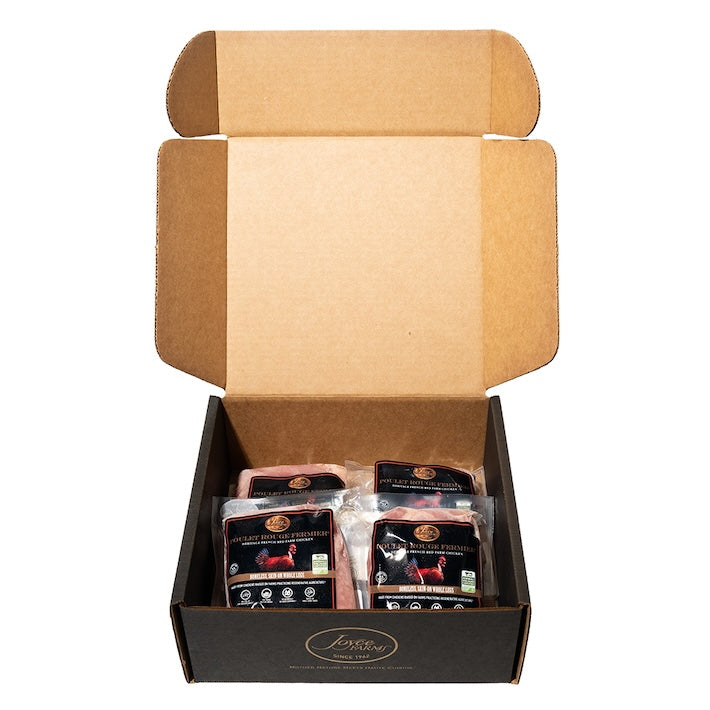 An open case of 4 packages of Joyce Farms Poulet Rouge® Heritage Boneless, Skin-On Whole Chicken Legs - Slow growing heritage breed from France, air chilled, pasture raised, certified GAP Step 4 by the Global Animal Partnership Animal Welfare Program, No Antibiotics, 100% Veg Fed, Raised on Small Family Farms