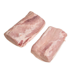 Two pieces of raw pork sirloin end loins on a white background