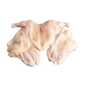 The raw, semi-boneless Poulet Rouge Heritage Chicken displayed against a white background, highlighting its pristine, farm-fresh quality.