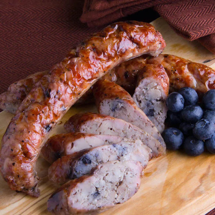 Grilled Blueberry Maple Naked Chicken Sausages, sliced with fresh blueberries.
