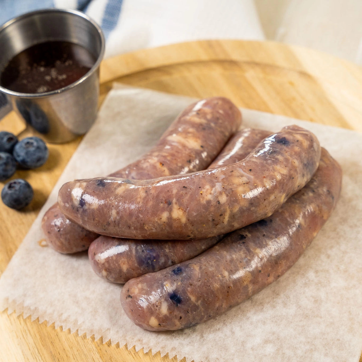 Raw Blueberry Maple Naked Chicken Sausages, with fresh blueberries and maple syrup