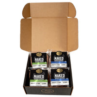 An open black box containing a savory variety pack of Joyce Farms Naked Chicken Sausages, made from antibiotic-free chicken. The pack includes two sweet flavors: Blueberry Maple and Apple & Raisin