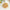 Bowl of ground meat on a white surface with a light background