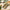 Joyce Farms, all-natural, no antibiotic or growth hormone, raw naked chicken spinach and feta sausage links stacked on wax paper that rests on a wooden cutting board. Spinach leaves, a ramekin of feta, and a green hand-towel rest nearby.