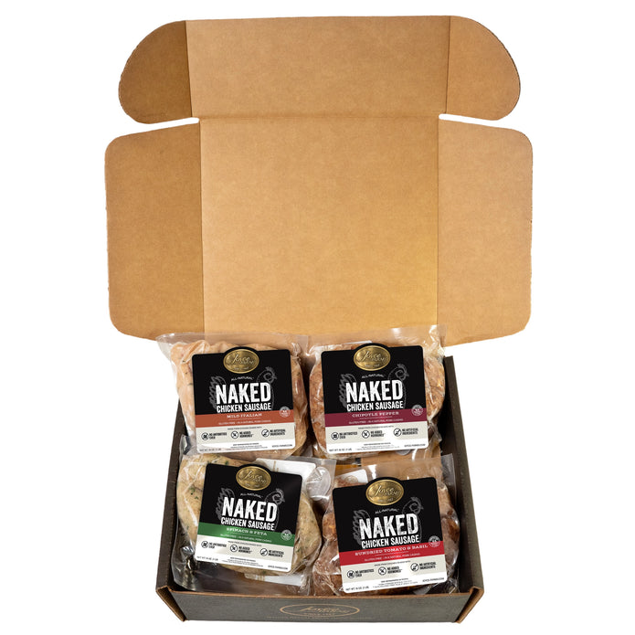 An open black box containing a savory variety pack of Joyce Farms Naked Chicken Sausages, made from antibiotic-free chicken. The pack includes four flavors: Sundried Tomato, Chipotle, Mild Italian, and Spinach & Feta. Each package of sausage is clearly labeled with its flavor.
