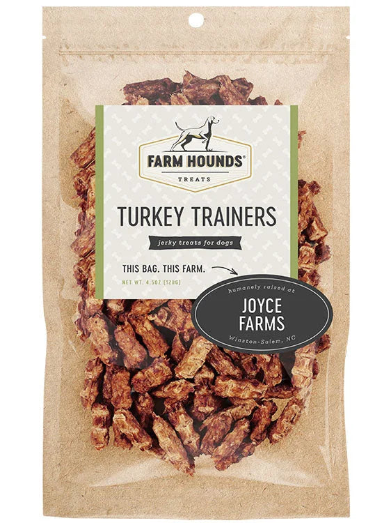 Front of Farm Hounds Turkey Trainers packaging, featuring dehydrated turkey jerky treats for dogs, made from 100% turkey sourced from Joyce Farms in Winston-Salem, NC. The packaging highlights the product’s natural quality and commitment to humane farming practices.